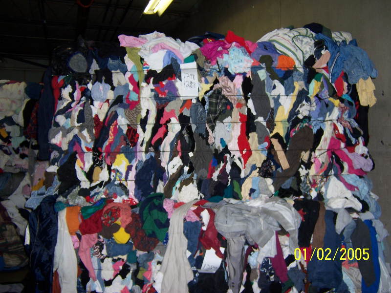 A large pile of clothes is piled on top of each other.