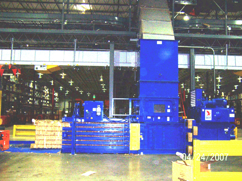 A warehouse with several large blue boxes.
