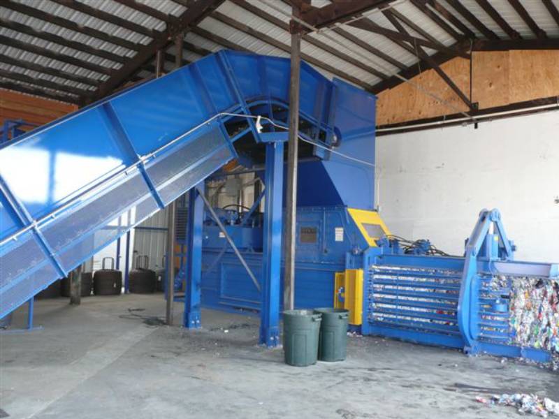 A large blue machine in a warehouse.