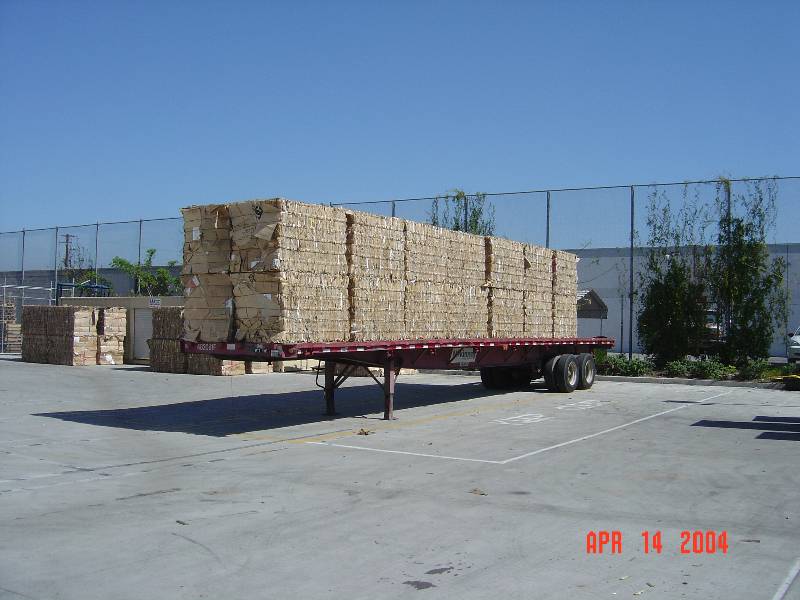A trailer with many wooden planks on it