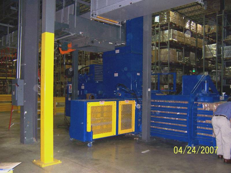 A warehouse with blue and yellow equipment.