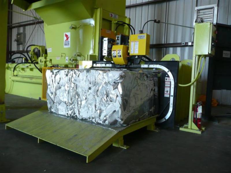 A large metal box on top of a machine.