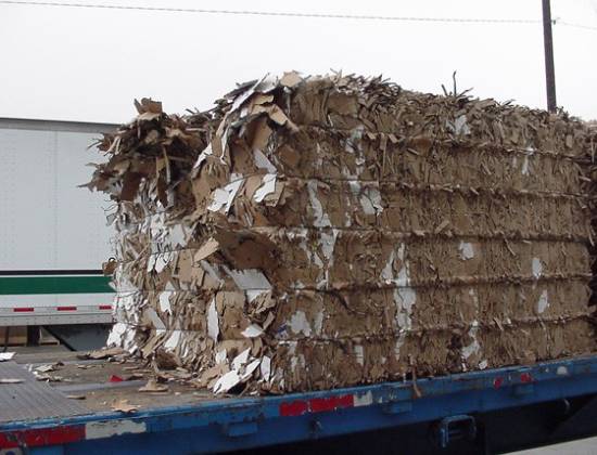 A truck with a large amount of cardboard on it