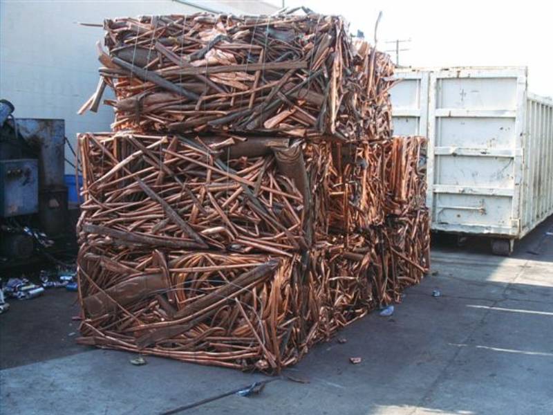 A large pile of wood sticks stacked on top of each other.