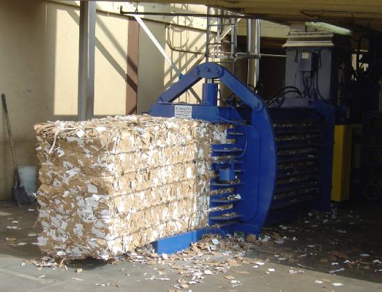 A large machine that is filled with cardboard.