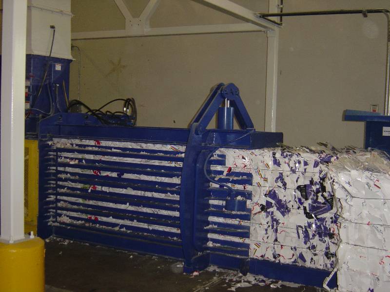 A large blue machine with purple paint on it.
