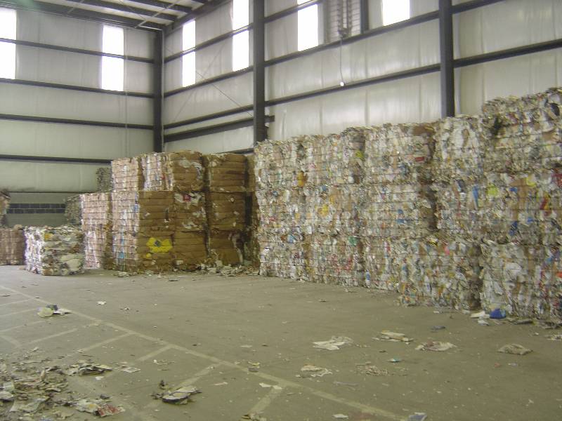 A warehouse filled with lots of cardboard boxes.
