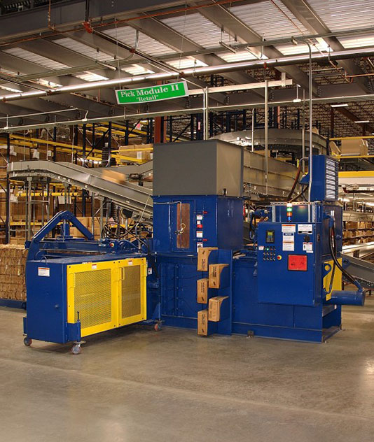 A large warehouse with boxes and a machine.