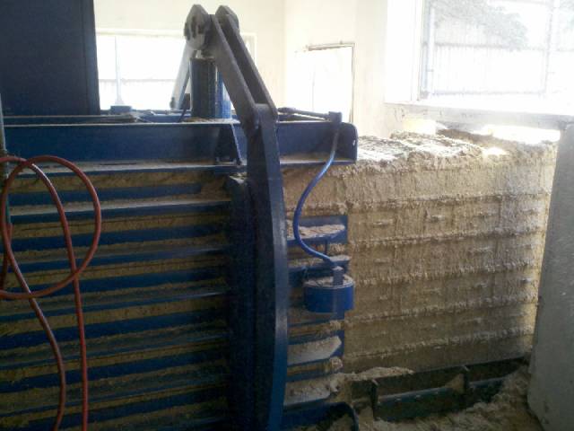 A machine that is stacked with hay.