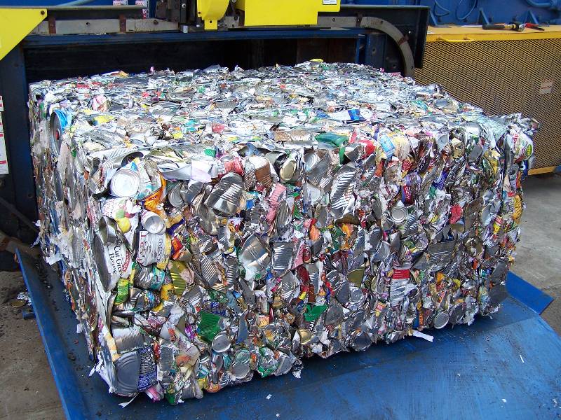A large amount of aluminum cans are stacked on top of each other.