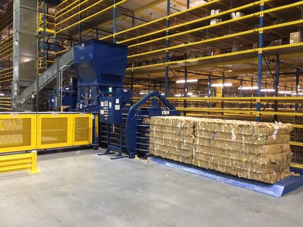 A warehouse with stacks of boxes on the floor.
