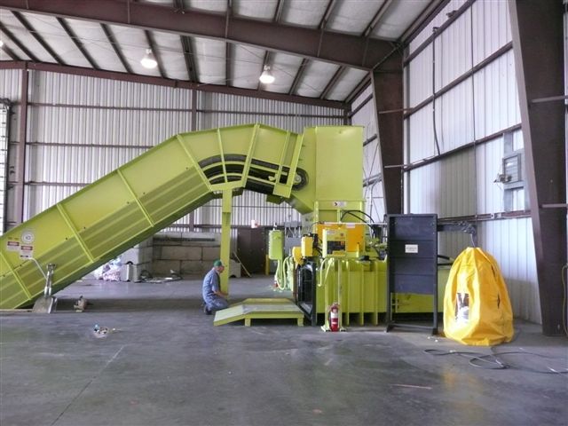 A large yellow machine in an industrial setting.