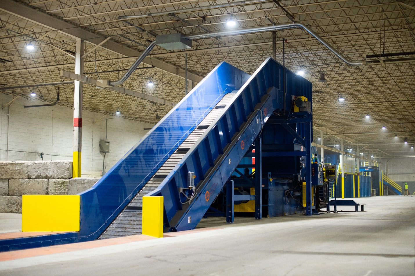 A blue and yellow loading dock with stairs going up.