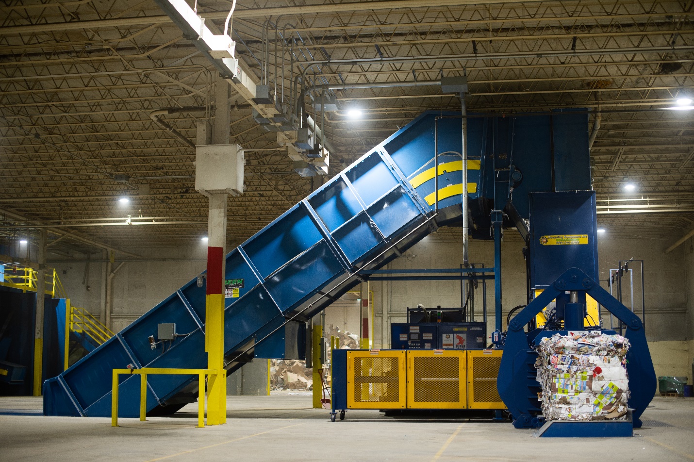 A large blue conveyor belt in a warehouse.